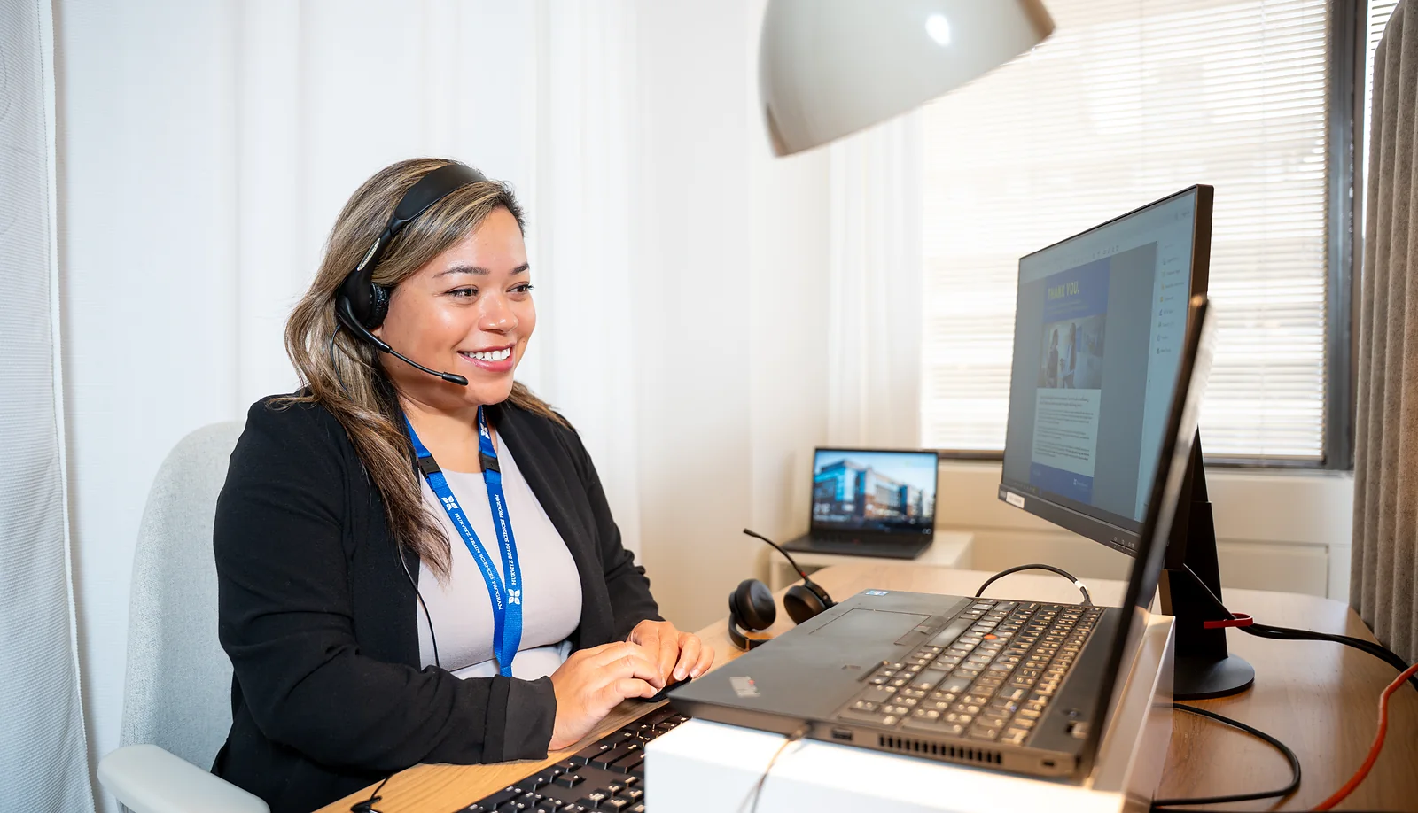 An FNP team member assisting someone through a headset