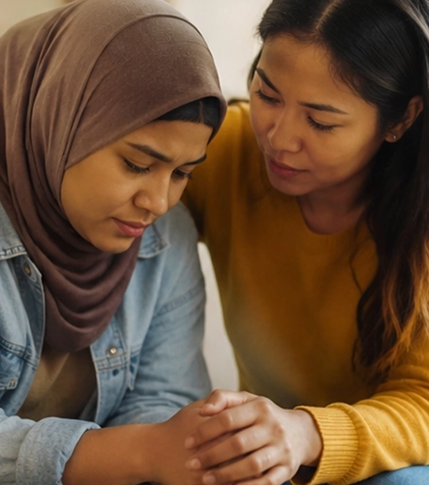 A caregiver comforting a young person